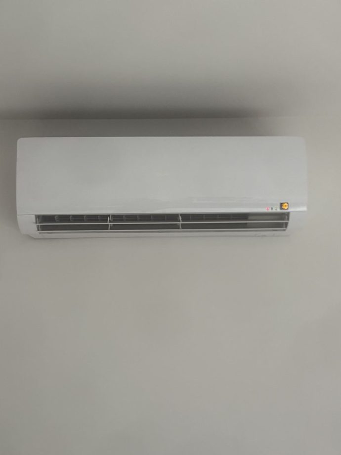White split system indoor unit mounted on a plain wall